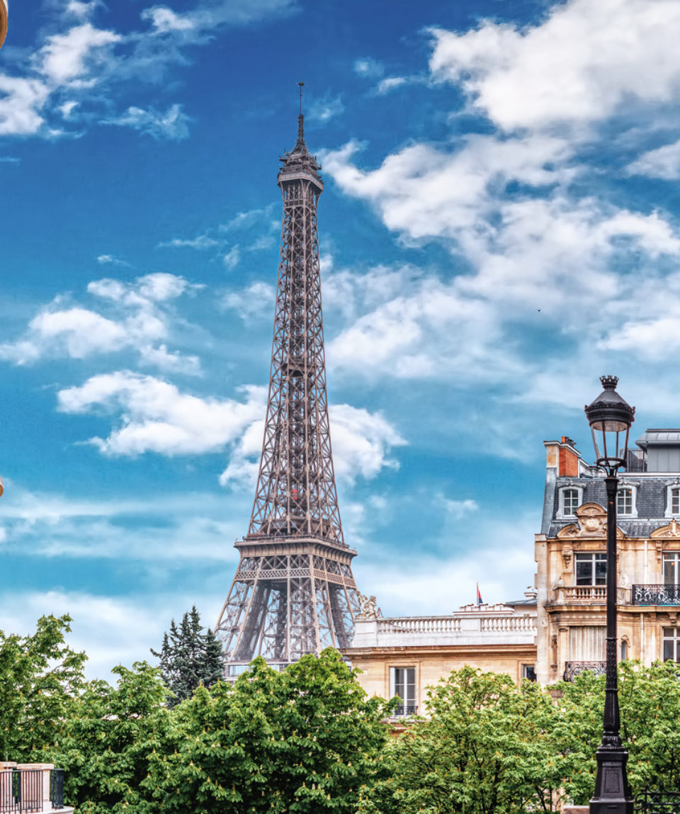 Small Paris street with view on the famous Eiffel Tower in Paris