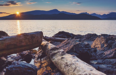 Sailing and rocky sunset beaches in the pacific north west with