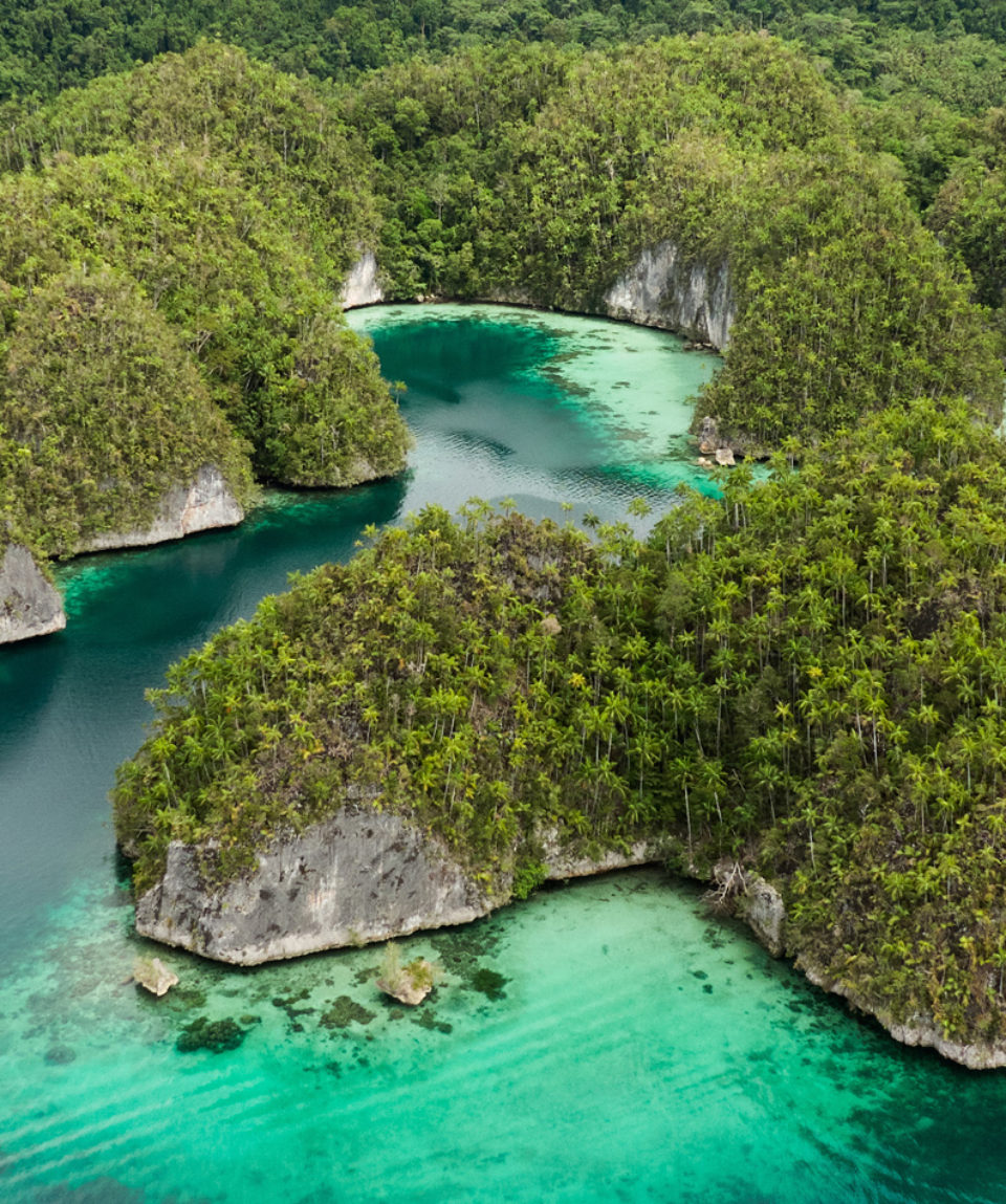 Aerial View Of Triton Bay In Raja Ampat Islands: Lagoon With Tur